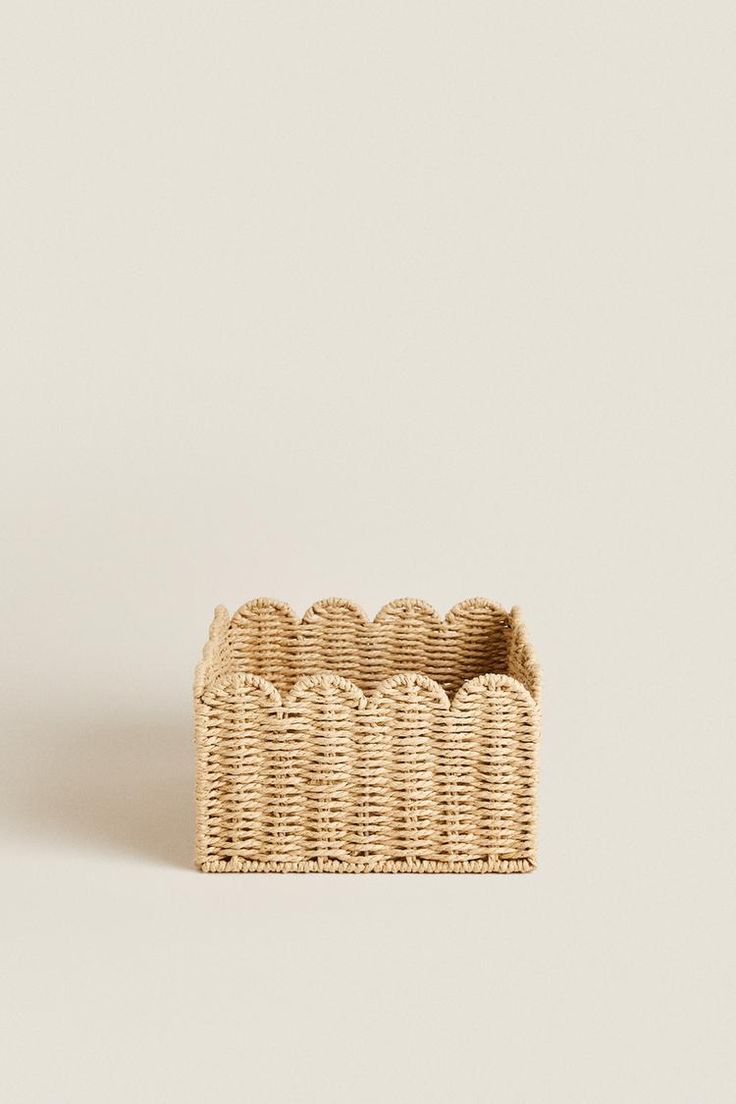 an empty wicker basket on a white background