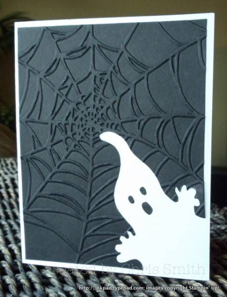 a halloween card with a ghost and spiderweave pattern on it's back