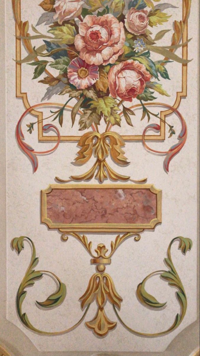 an ornately decorated wall with flowers on it