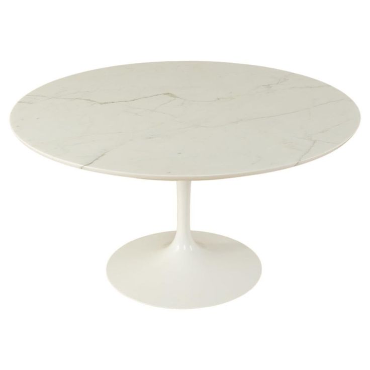 an oval marble dining table with white pedestals and a circular base, on a white background