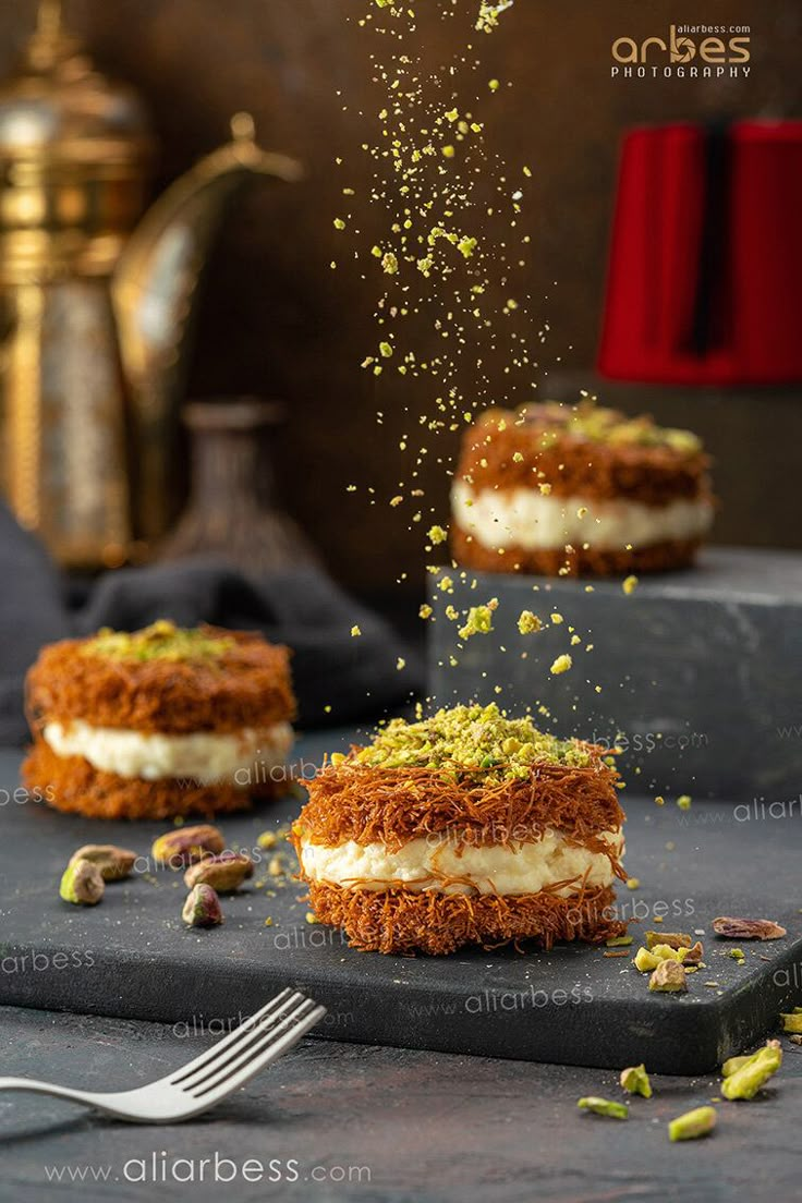 some food is being sprinkled on top of each other and sitting on a table