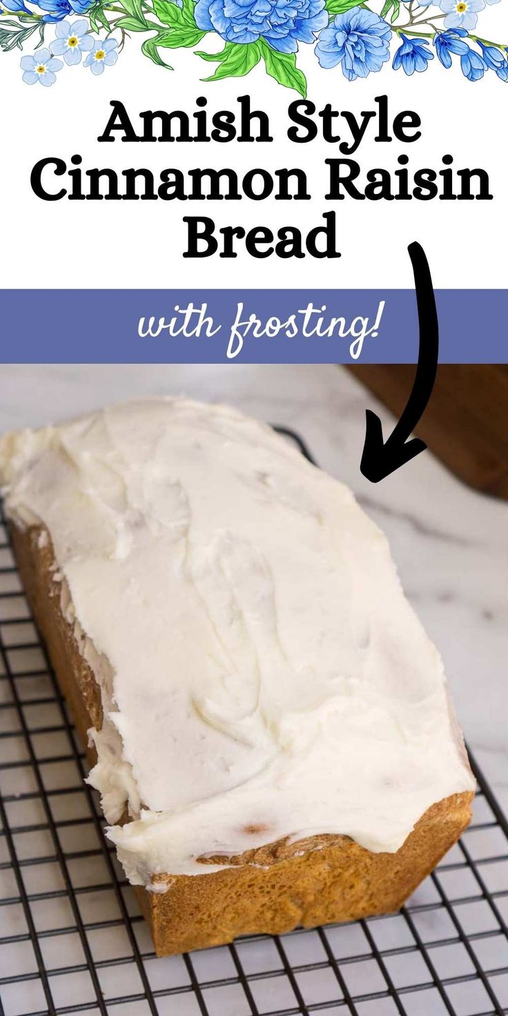 a loaf of cinnamon raisin bread on a cooling rack with frosting and blue flowers