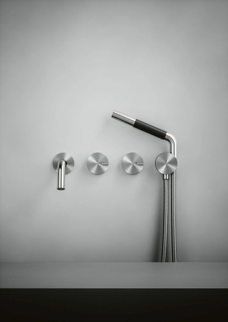 three different faucets are shown in this black and white photo, one is on the wall