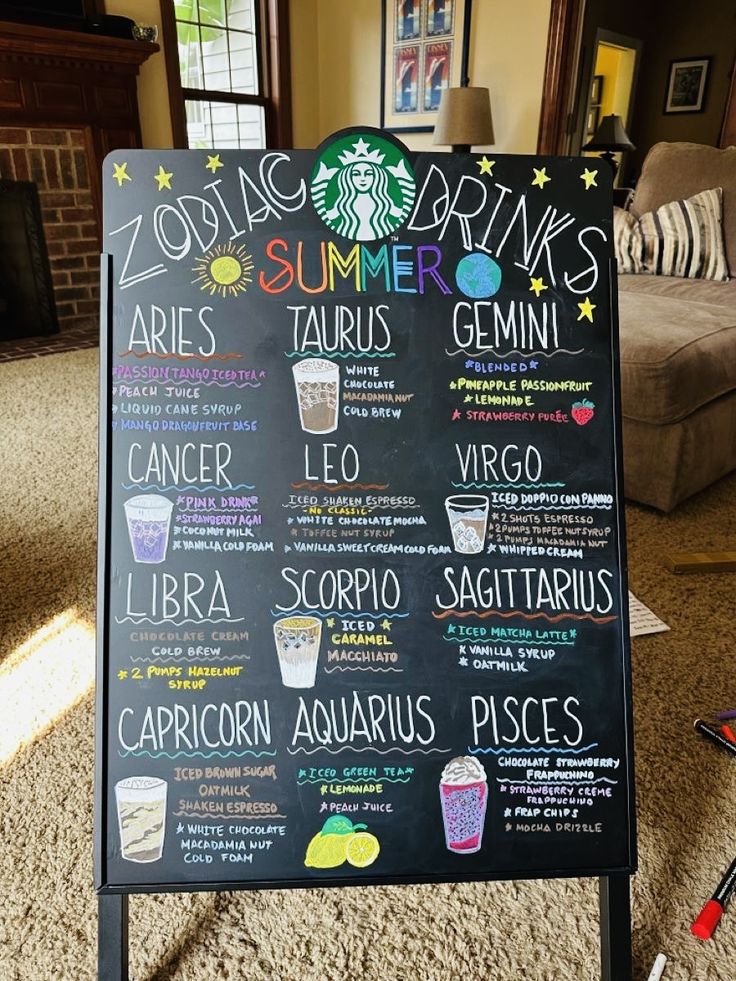 a menu board with drinks on it in a living room