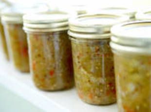 several jars filled with food sitting on top of a table