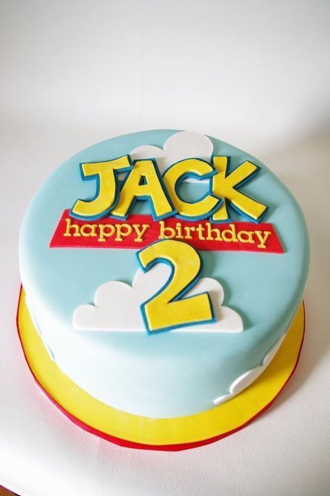 a birthday cake with the name jack 2 on it, and an image of two clouds