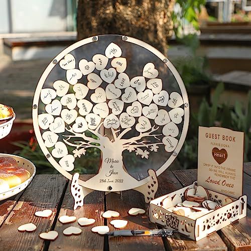 a table topped with plates and pies next to a tree cut out of paper