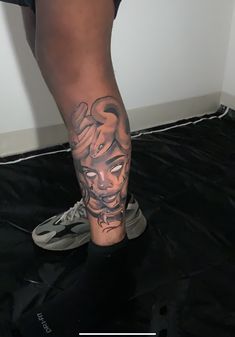 a person with a tattoo on their leg