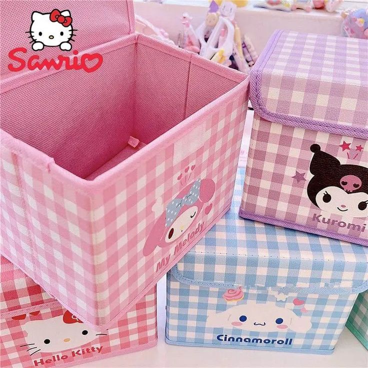 hello kitty storage bins are lined up on the table