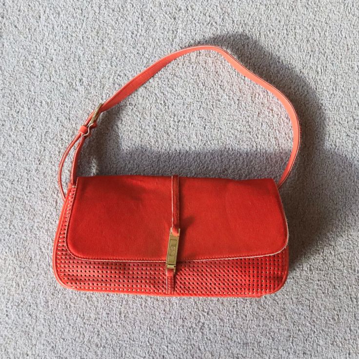 Gorgeous bright red cowhide bag by Sonia Rykiel with gold hardware. Perforated effect body. Squeeze the gold clasp to open! Great vintage condition. MEASUREMENTS: Length: approx. 28cm  Height: approx. 14.5cm Depth: approx. 6.5cm Handle drop: approx. 19cm (at shortest point, can be made longer by approx. 9cm) Cowhide Bag, Sonia Rykiel, Bright Red, Gold Hardware, Purses And Handbags, Shoulder Bags, Bathing Beauties, Accessory Gift, Pet Supplies