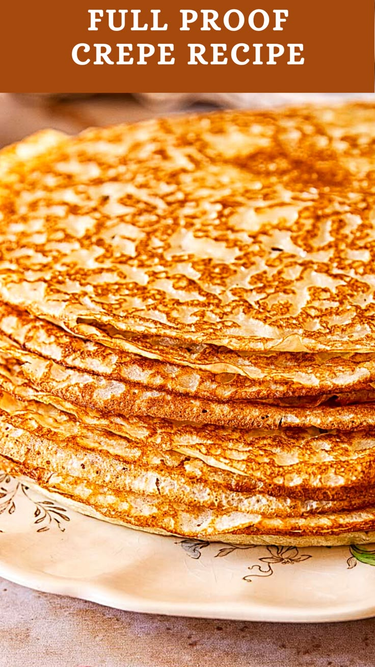 a stack of pancakes sitting on top of a white plate