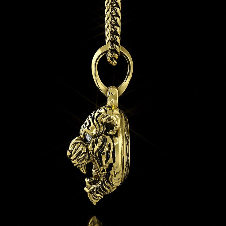 In some cultures, the Tiger is known as the king of all beasts. It is a powerful symbol of strength, honor, and bravery. Our solid gold Tiger pendant is masterfully crafted with diamonds in the growling Tiger's eyes and a AAA quality blood red, color-enhanced diamond in the Sun bezel. Notice the unparalleled detail in the branches of the Greeting Pine trees (from the Tiger's native landscape, also representing the virtues of self-discipline and fortitude), the dramatic granite peaks, and the sta Gold Pendants For Men, Pendants For Men, Tiger Necklace, Gold Tiger, Tiger Pendant, Wolves Pendants, Gold Pendants, Diamond Pendants, Solid Gold Necklace