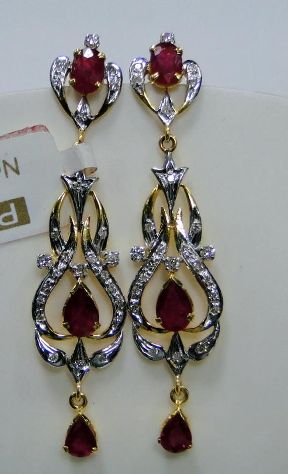 14 K solid gold Ruby Diamond Earrings. Length-4.8 cm, weight-5 grams, Ruby weight-5 cts.Diamond weight-0.40 cts. Diamond Dangle Earrings, Gold Bead Necklace, Movie Fashion, Silver Gemstone Jewelry, Gold Diamond Earrings, Buying Diamonds, Royal Jewelry, Ruby Diamond, Ruby Gemstone