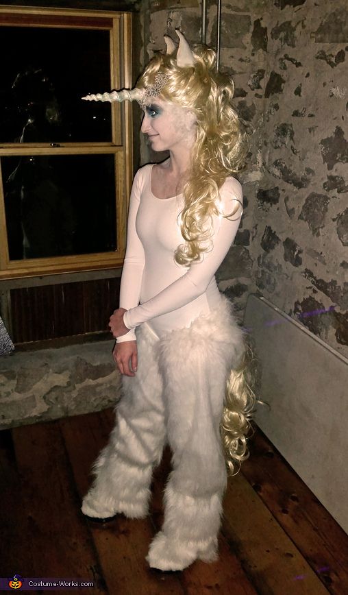 a woman dressed as a unicorn with long blonde hair