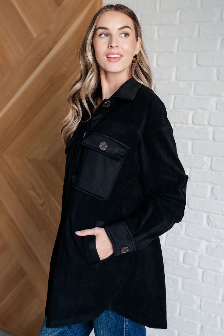 Step up your outerwear game with the Fantastic in Fleece Jacket in Black. Featuring a classic collared neckline, it’s designed with functional button closures for a tailored fit. Contrast panels add a modern twist, while elbow patches lend a touch of rugged charm. Practicality meets style with functional chest patch and side welt pockets, providing ample storage for your essentials. Perfect for layering over any casual outfit, this jacket is a versatile and chic addition to your wardrobe. Knit F Classic Black Outerwear With Buttoned Pockets, Black Single-breasted Shacket For Winter, Black Winter Outerwear With Button Cuffs, Black Collared Winter Blazer, Fall Fleece Jacket With Pockets For Workwear, Fall Workwear Fleece Jacket With Pockets, Black Collared Blazer For Winter, Black Button-up Utility Jacket For Winter, Black Utility Jacket With Buttons For Winter