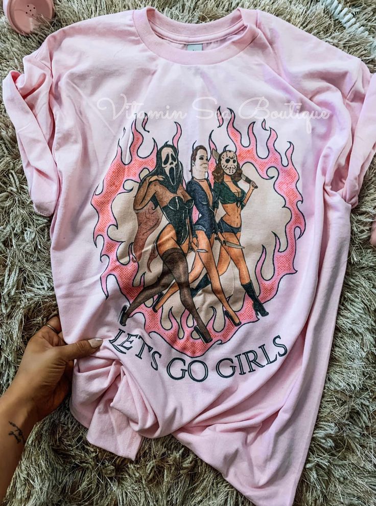 Horror Let’s Go Girls Tee Sizes: S-3XL Color: pink Tee: $36 TAT: 7-14 business days Pink Y2k Long Sleeve T-shirt, Trendy Pink Tops With Funny Print, Trendy Pink Top With Funny Print, Pink T-shirt For Fall Streetwear, Pink Y2k Shirt For Spring, Fitted Pink Graphic Tee Shirt, Pink Y2k Style Spring Shirt, Pink Graphic Print Top For Fall, Pink Funny Print Top For Streetwear