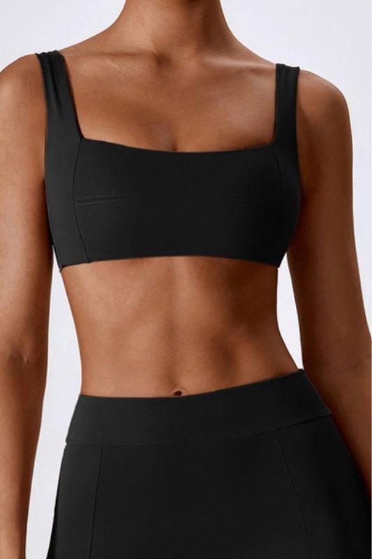 Made from the highest quality fabric, this bra offers superior comfort and support during even the most intense workouts. The edgy design features sleek lines and a flattering cut that perfectly complements your curves, while the moisture-wicking material keeps you cool and dry. With this sports bra, you can be confident that you're getting the perfect combination of fashion and function. Whether you're hitting the gym or going for a run outside, this bra is the perfect addition to your workout Sleek Yoga Activewear With Built-in Bra, Black Sculpting Activewear With Built-in Bra, Modern Stretch Sports Bra With Built-in Bra, Sculpting Activewear With Built-in Padding For Workout, Contoured Sports Bra With Built-in Bra For Yoga, Athleisure Sports Bra With Built-in Padding And Wide Straps, Black Sports Bra With Seamless Construction And Wide Straps, Sculpting Black Activewear With Built-in Bra, Black Sculpting Sports Bra For Sports