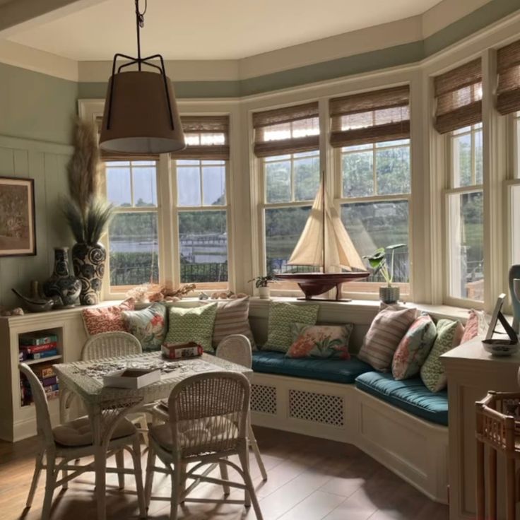 a living room filled with furniture and lots of windows