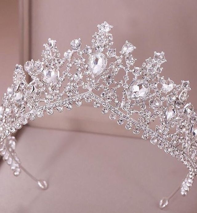 a tiara with crystal stones and pearls