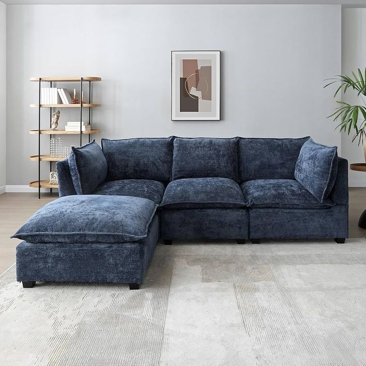 a living room with a blue sectional couch