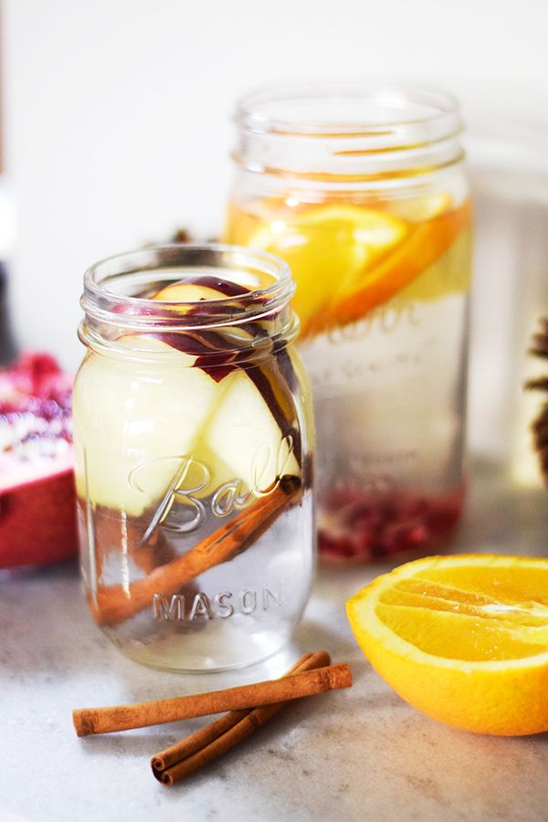 two mason jars filled with lemons and cinnamon