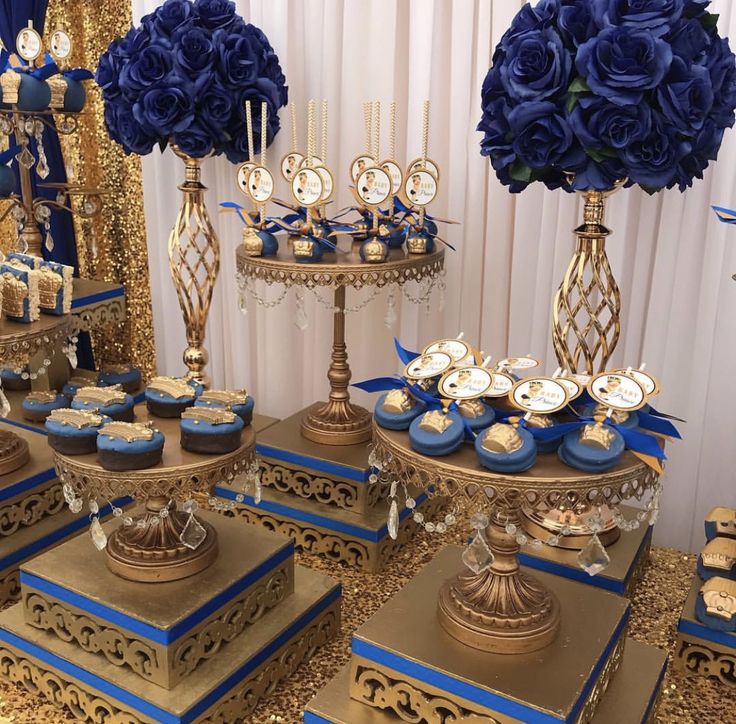 blue and gold dessert table with cupcakes