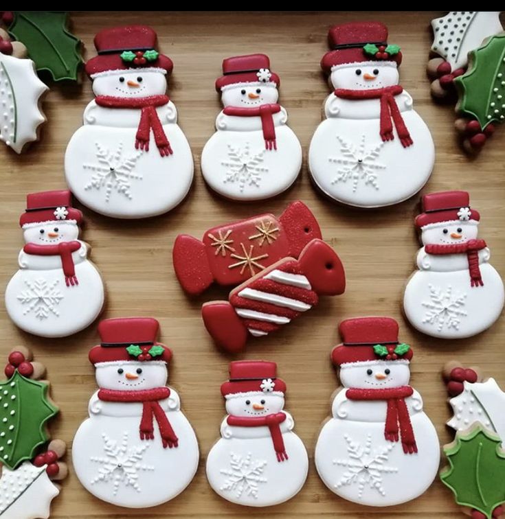 snowman cookies are arranged on a table