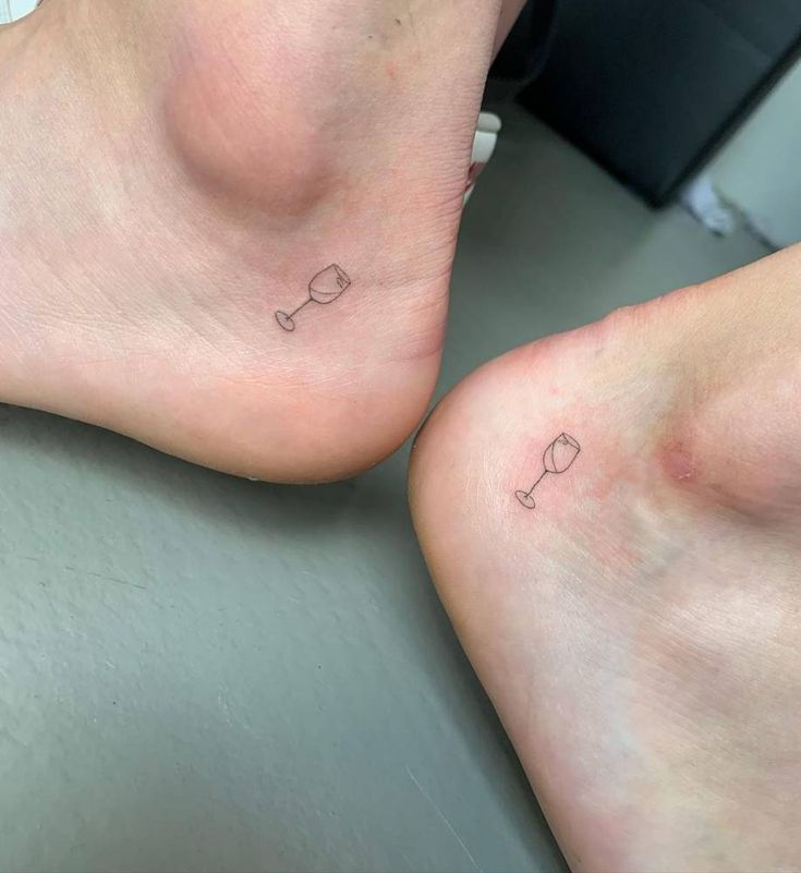 two people with small tattoos on their feet