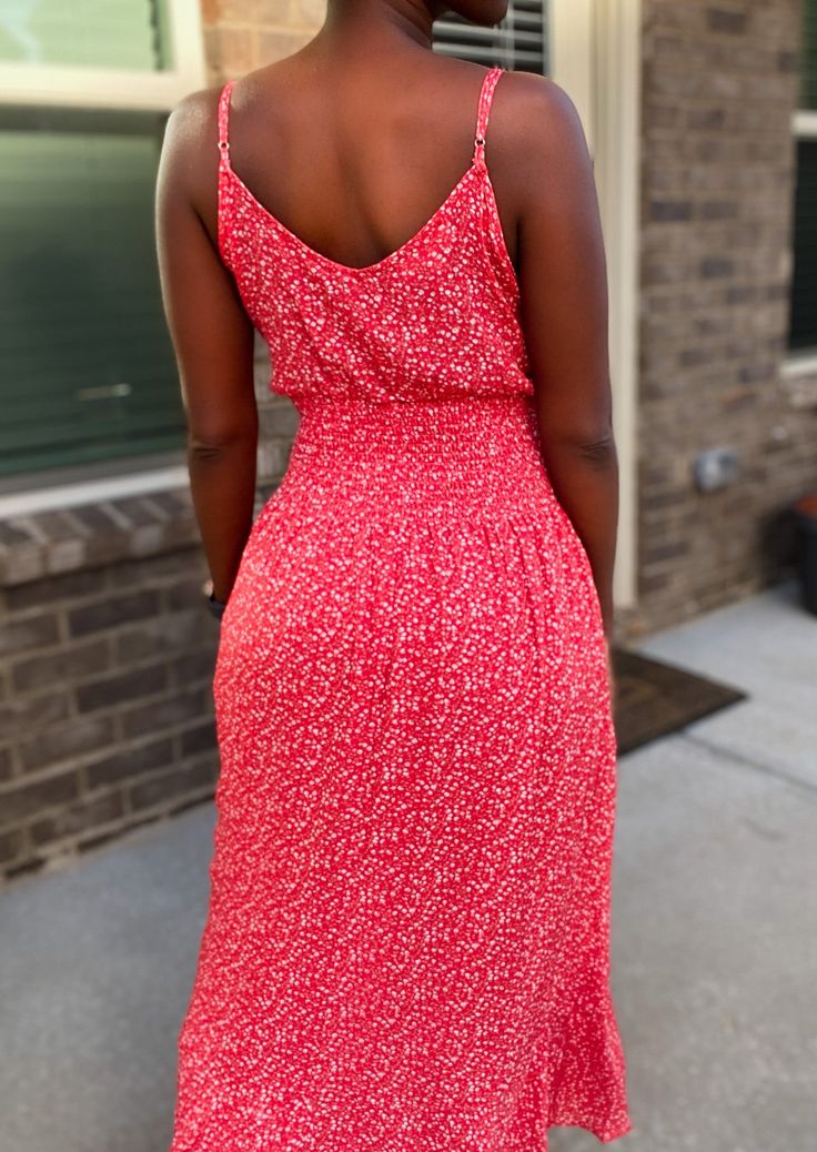 Spring is here and floral sundresses are all the rage! This beautiful red floral midi dress is no exception. It is light and flowing. The perfect outfit for a summer or spring day! Toss on a pair on sneakers, cute wedges, or comfy flip flops and you’re ready to go in this dress! This dress features a front button closure, is mid calf length and has adjustable straps. It fits true to size. Model is 5’4 and is wearing a size Small. 100% rayon Midi dress Fit and flare Adjustable spaghetti strap Fro Orange Sundress, Comfy Flip Flops, Red Sundress, Sneakers Cute, Cute Wedges, Floral Sundress, Spring Is Here, On Sneakers, Spring Day