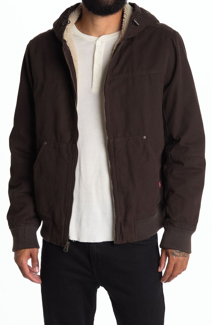 Stay warm in this hooded bomber jacket featuring soft faux shearling hood and body lining, convenient front pockets, and comfortable ribbed knit trim. 26" length (size M) Attached drawcord hood Long sleeves Front zip closure Split kangaroo pockets Woven construction Faux shearling lined hood and body Insulated Ribbed knit cuffs and hem Shell: 100% cotton/faux shearling body/hood lining: 100% polyester/sleeve lining: 100% polyester/fill: 100% polyester/rib knit: 99% polyester, 1% elastane Machine Brown Hooded Jacket For Fall With Zipper Closure, Brown Hooded Jacket For Fall With Zipper, Fall Hooded Outerwear With Ribbed Cuffs, Fall Streetwear Utility Jacket With Double-lined Hood, Brown Hooded Jacket With Zipper For Winter, Brown Hooded Outerwear With Ribbed Cuffs, Fall Utility Jacket With Double-lined Hood For Streetwear, Winter Brown Hooded Jacket With Zipper, Urban Hoodie With Ribbed Collar For Fall