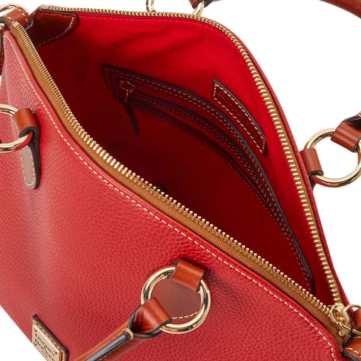 On The Go  This stunning satchel, crafted from textured leather with a natural grain that hides any signs of wear, will upgrade every look in moments. Pebbled Leather Satchel With Zipper Closure, Red Leather Satchel With Zipper Closure, Red Pebbled Leather Bag For Everyday Use, Red Top Handle Satchel With Textured Leather, Red Top Handle Bag With Smooth Grain, Red Textured Leather Satchel With Top Handle, Red Smooth Grain Satchel Shoulder Bag, Red Textured Leather Tote Satchel, Red Textured Leather Top Handle Satchel