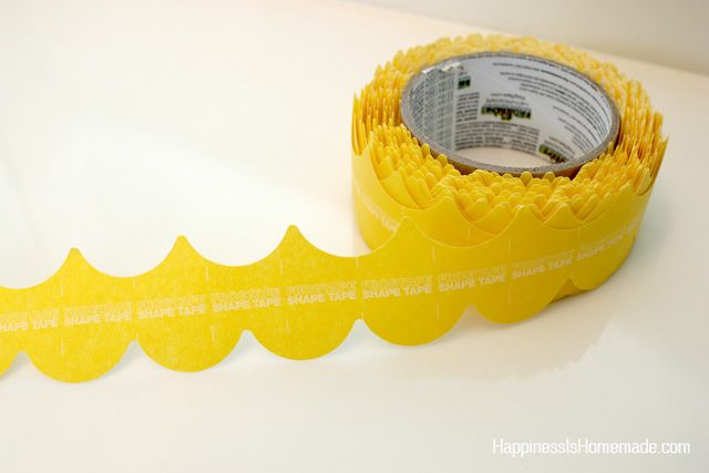 a roll of yellow tape sitting on top of a table