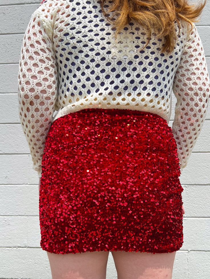 THE DREAM PARTY SKIRT IS HERE!!!! This Red Sequin Skirt will have heads turning at how cute your outfit is! Style with a sweater and tights for a holiday outing or your favorite bodysuit for a party look! This sparkly red looks amazing with greens, pinks, blues, whites, and blacks! The cutest and sparkliest skirt Style with sweaters, cute tops, and tights Pairs well with blue, green, pink, white, and black True to size. 95% Polyester 5% Spandex Kalianna is 5'7 wearing a size small and typically Winter Party Mini Skirt With Stretch, Fitted Winter Skort For Night Out, Red Stretch Skirt For Fall, Fitted Skort For Winter Night Out, Stretch Mini Skirt For Winter Party, Red Festive Holiday Skirt, Red Skirt For Christmas Holiday, Red Holiday Festive Skirt, Red Party Bottoms Mini Length