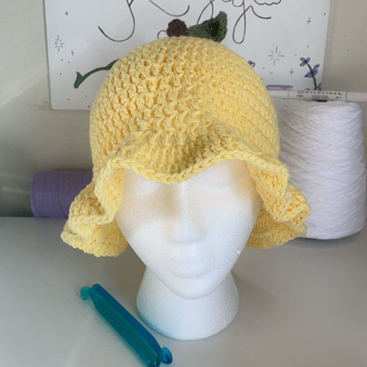 Introducing the Crochet Lemon Bucket Hat! This zesty accessory brings a burst of citrusy freshness to your style. Meticulously crafted with bright yellow yarn and adorned with cute lemon slices, it's a playful and vibrant addition to your wardrobe. Whether you're soaking up the sun or adding a pop of color to your outfit, this crochet lemon bucket hat is the perfect blend of fashion and fun. Embrace the sunny vibes and stand out with this delightful and handmade hat! Yellow Beach Bucket Hat, Trendy Crochet Hat For Spring, One Size, Trendy Crochet Hat For Spring, Trendy One Size Crochet Hat For Spring, Yellow Crochet Beach Hat, Yellow Knitted Beach Hat, Yellow Summer Hat, One Size Fits Most, Yellow Summer Bucket Hat For Spring, Yellow Summer Hats One Size