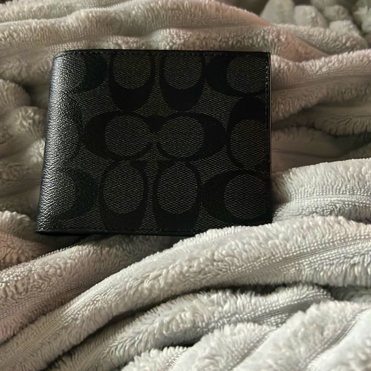 This A Brand New Never Used Black Coach Wallet. It Has 10 Card Holders And Two Separated Pieces At The Top For Cash, Extra Cards, Etc. Black Mens Coach Wallet Designer Black Wallets With Interior Card Slots, Luxury Black Trifold Wallet For Daily Use, Designer Black Wallet For Everyday Use, Designer Black Wallets For Everyday Use, Designer Black Bifold Wallet, Designer Black Wallet For Daily Use, Coach Black Rectangular Trifold Wallet, Coach Black Trifold Wallet For Everyday Use, Coach Black Trifold Wallet