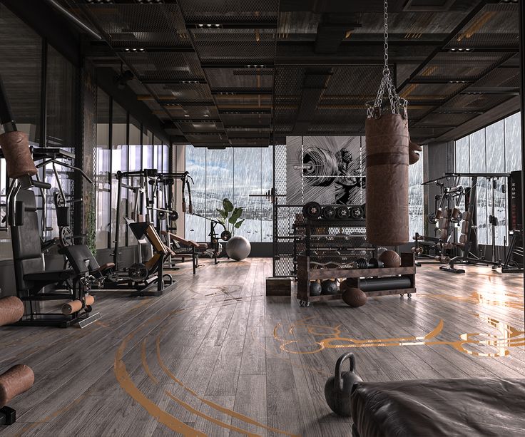 an empty gym with lots of machines and exercise mats on the floor in front of large windows