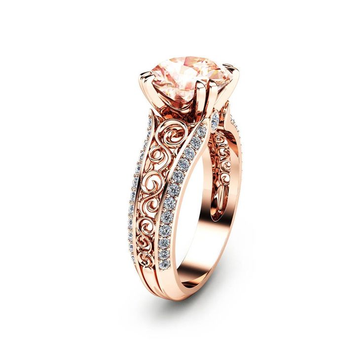 a rose gold ring with an oval cut diamond in the center and side stones on each band