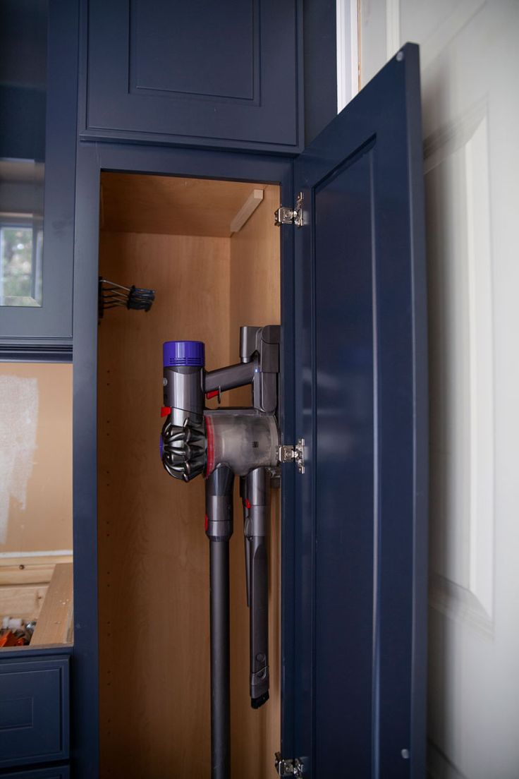 a close up of a vacuum in a cabinet