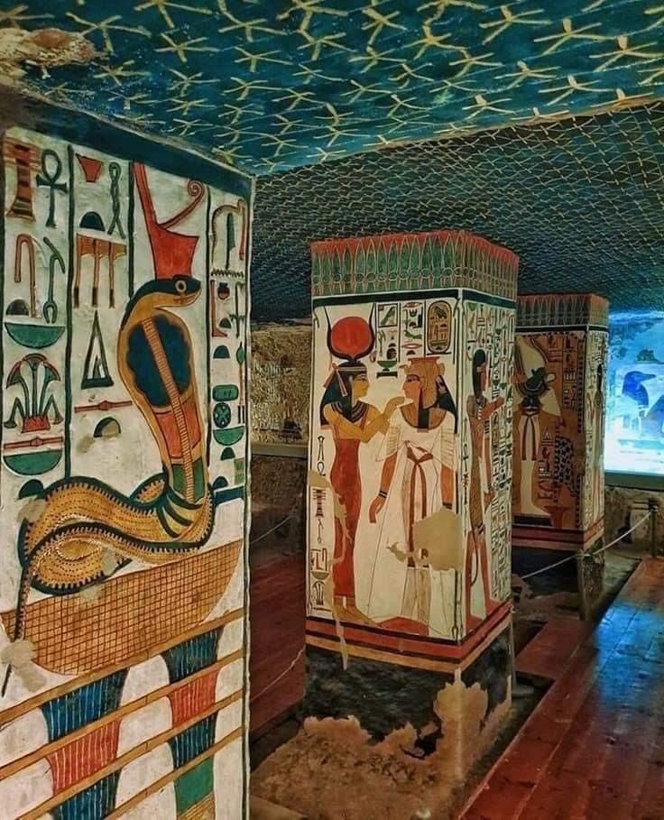 an egyptian style room with paintings on the walls