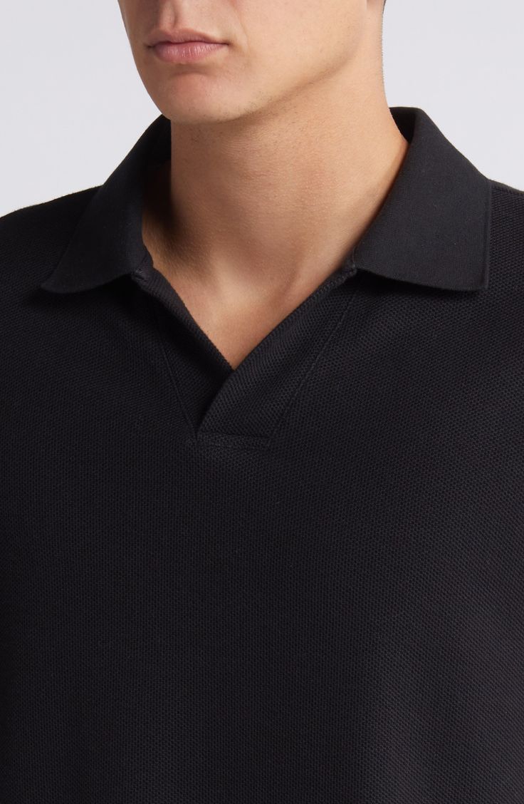 Build your casual look with the versatile style of this polo made from cool, breathable cotton jacquard. 26 1/2" length (size Medium) Spread collar Short sleeves 100% cotton Machine wash, tumble dry Imported Black Short Sleeve Polo Sweater For Work, Black Cotton Polo Sweater With Ribbed Collar, Black Polo Collar Sweater For Work, Black Polo Shirt With Seamless Collar For Work, Black Cotton Polo Sweater For Work, Black Cotton Polo Sweater, Black Fitted Cotton Polo Sweater, Fitted Black Cotton Polo Sweater, Black Polo Sweater With Collared Neckline For Workwear