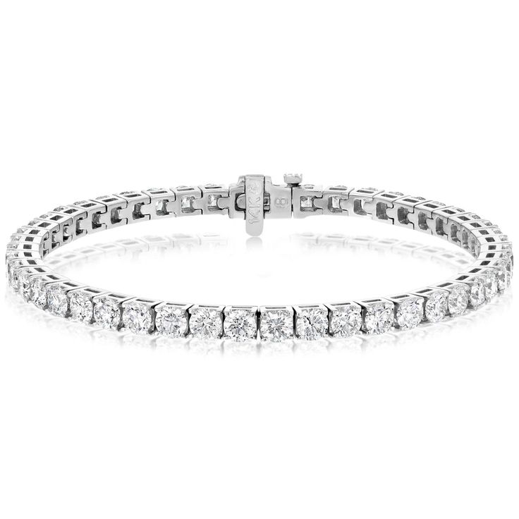 14K white gold 7" diamond bracelet from the Reis-Nichols collection. The bracelet features 48 round brilliant cut diamonds weighing approximately 9.00 ctw. Diamond Tennis Bracelet, Tennis Bracelet Diamond, Style Gift, Tennis Bracelet, Round Brilliant Cut Diamond, Brilliant Cut Diamond, Round Brilliant, Diamond Bracelet, Diamond Cuts