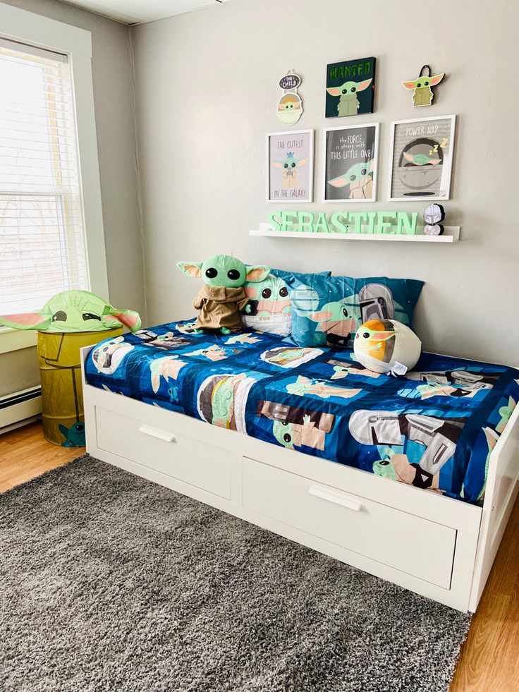 a child's bedroom with star wars themed bedding