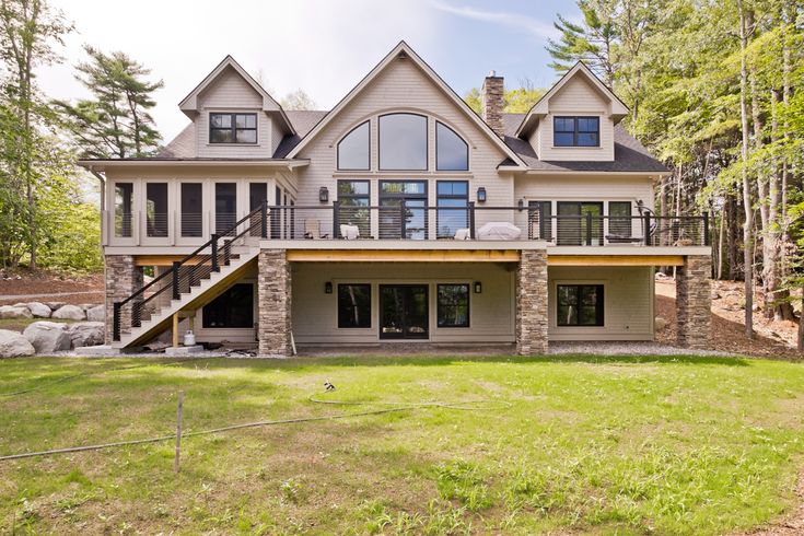 this is an image of a large house in the country side with stairs leading up to it