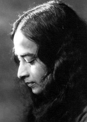 an old photo of a woman with long hair