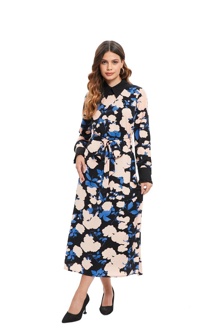 The Sapphire Bloom Midi Dress brings the mystique of twilight gardens into your wardrobe with its striking pattern of sapphire blue flowers set against a contrasting backdrop. The bold color palette exudes confidence, while the cinched waist and fluid skirt flatteringly embrace the body, perfect for any event where making an impression is key. Long sleeves finished with chic cuffs and a modest midi length offer both elegance and coverage. For additional comfort and a polished look, the dress is Blue Floral Midi Dress For Work, Blue Floral Print Midi Dress For Work, Elegant Blue Floral Long Sleeve Dress, Elegant Blue Long Sleeve Floral Dress, Elegant Long Sleeve Blue Floral Dress, Blue Long Sleeve Maxi Dress With Tie Waist, Long Sleeve Blue Maxi Dress With Tie Waist, Bold Color Palette, Cinched Waist