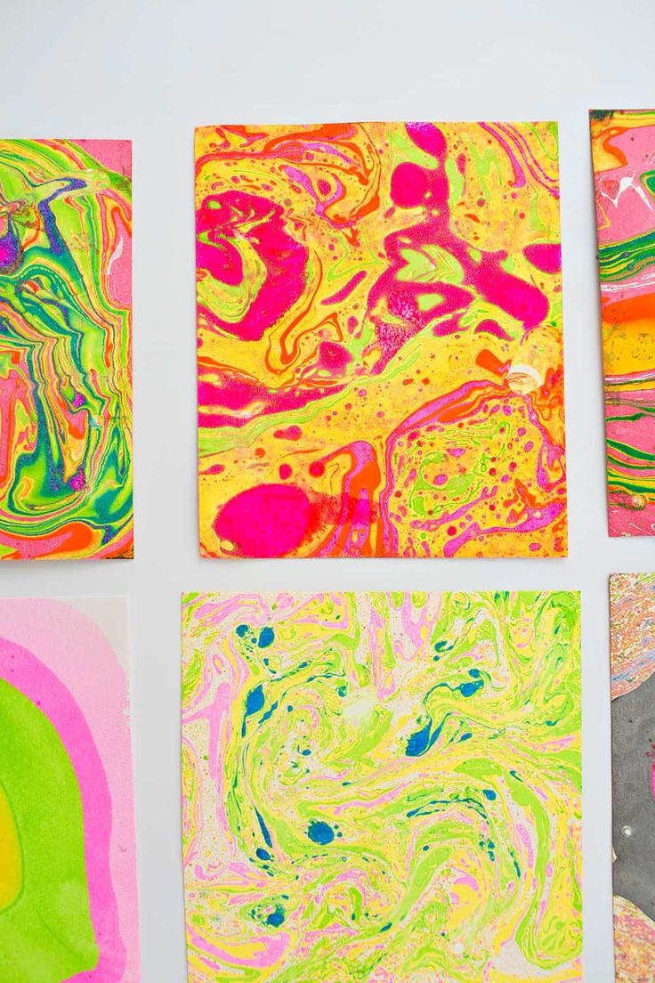 four square paintings with different colors on them