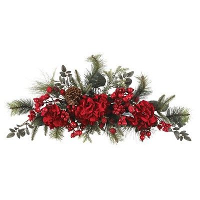 red flowers and greenery are arranged in a row on a white background with pine cones