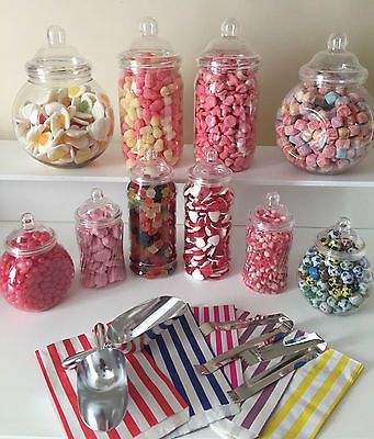 there are many different types of candies in the jar and on the shelf next to each other