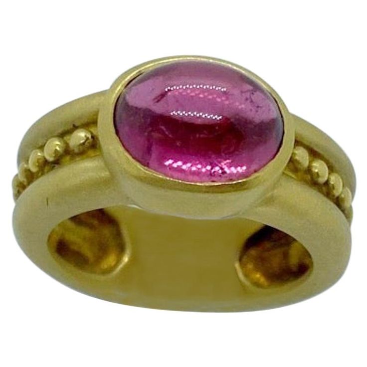 An 18 karat yellow gold ring designed with an oval cabochon pink tourmaline center. The stone is set east /west on a matte shank detailed with gold beads. Stamped 750 Finger size 6.25 Ginkgo Leaves, Oval Diamond Ring, Pink Tourmaline Ring, Indian Jewellery Design Earrings, Gold Ring Designs, Jewelry Design Earrings, Wax Casting, Design Earrings, Tourmaline Ring