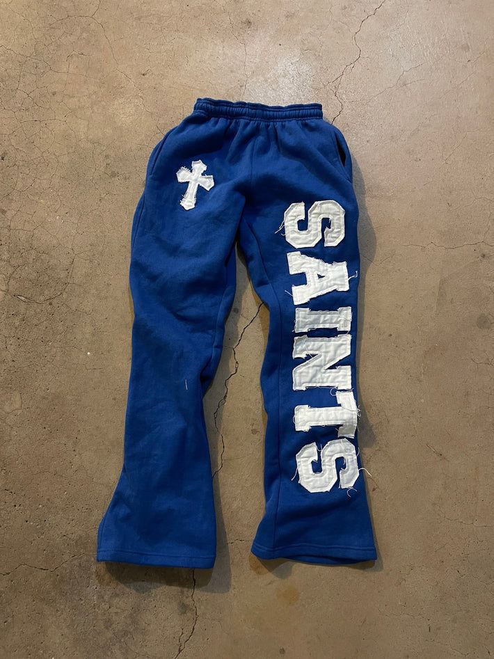 Saints Printed Sweatsuit Set — My 3D Hoodie One Leg Pants, Good Sweatpants Brands, 2000s Street Fashion, Christian Pants, Blue Joggers Outfit, Sweatpants Design, Streetwear Fashion Pants, Hip Hop Street Fashion, Stacked Sweatpants